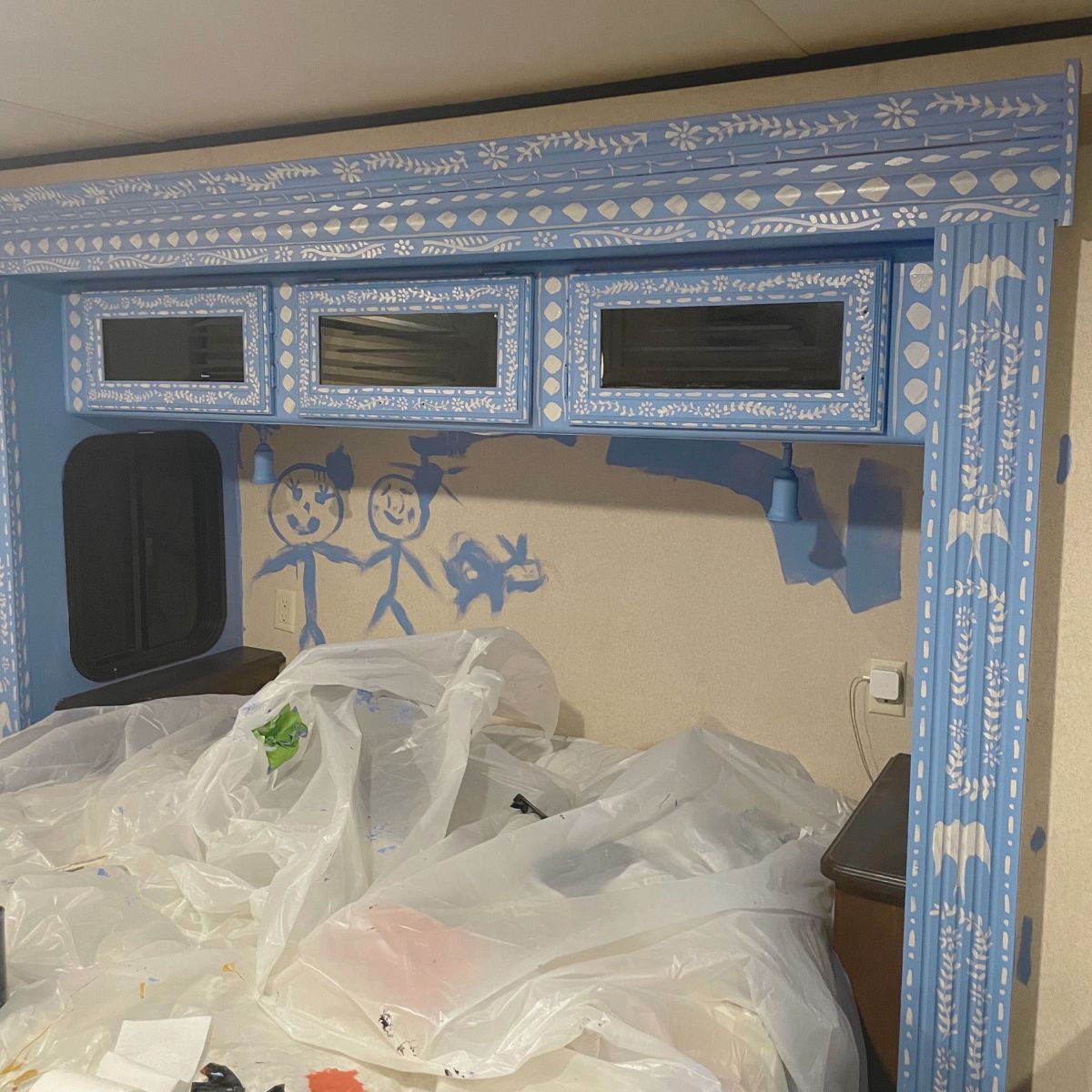 blue painted bed slide out cubbards and trim in travel trailer